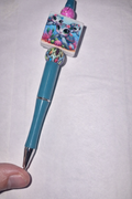 Whimsical otter pen with colorful details