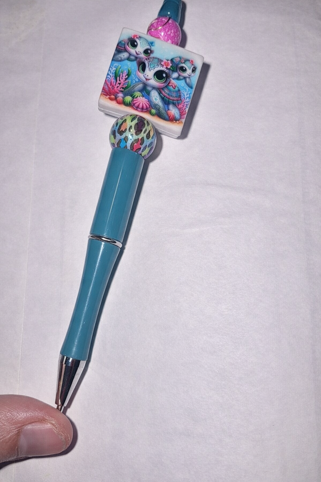 Whimsical otter pen with colorful details